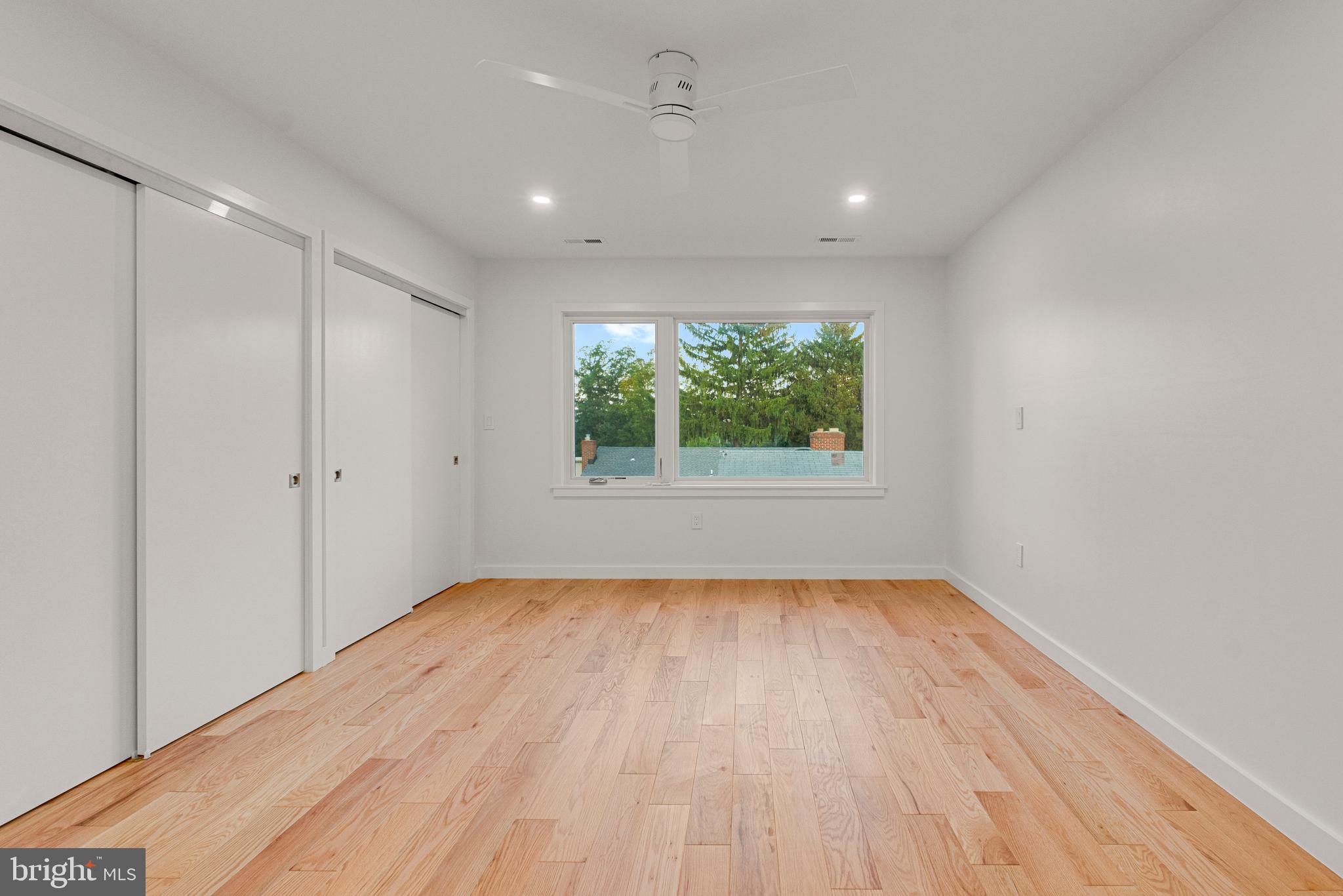2706 Bartol Avenue Baltimore, MD 21209 - Photo 47 of 62 a view of an empty room with wooden floor and window