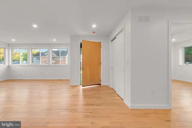 a view of an empty room with a window