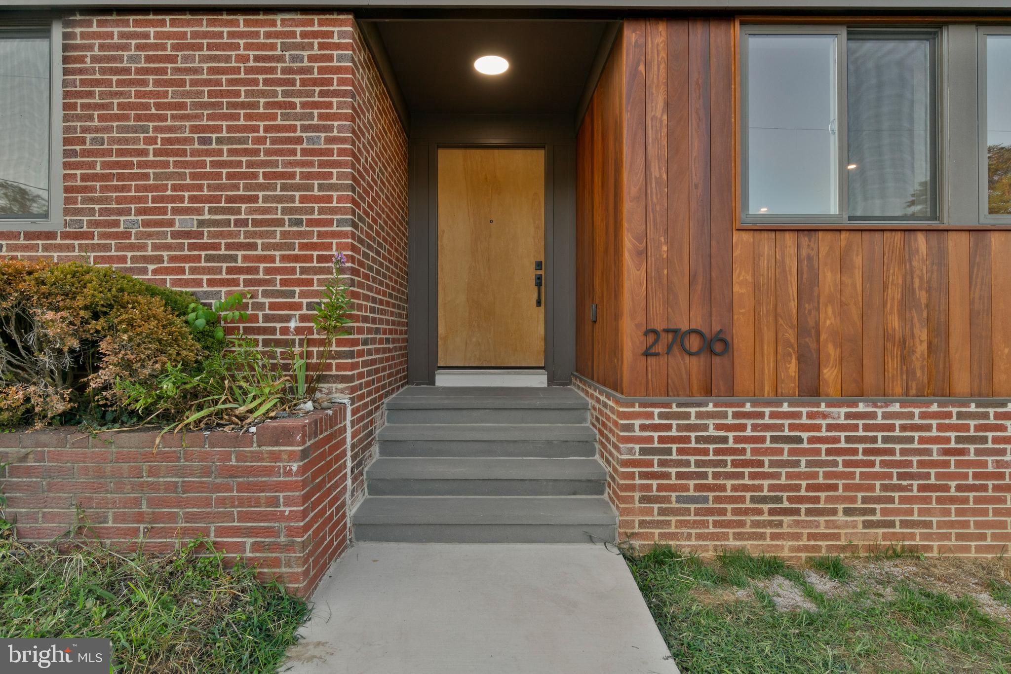 2706 Bartol Avenue Baltimore, MD 21209 - Photo 58 of 62 a view of a pathway with a wooden door