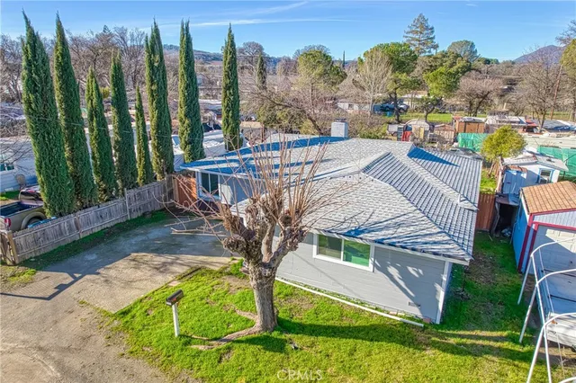 an aerial view of a house with a ocean view