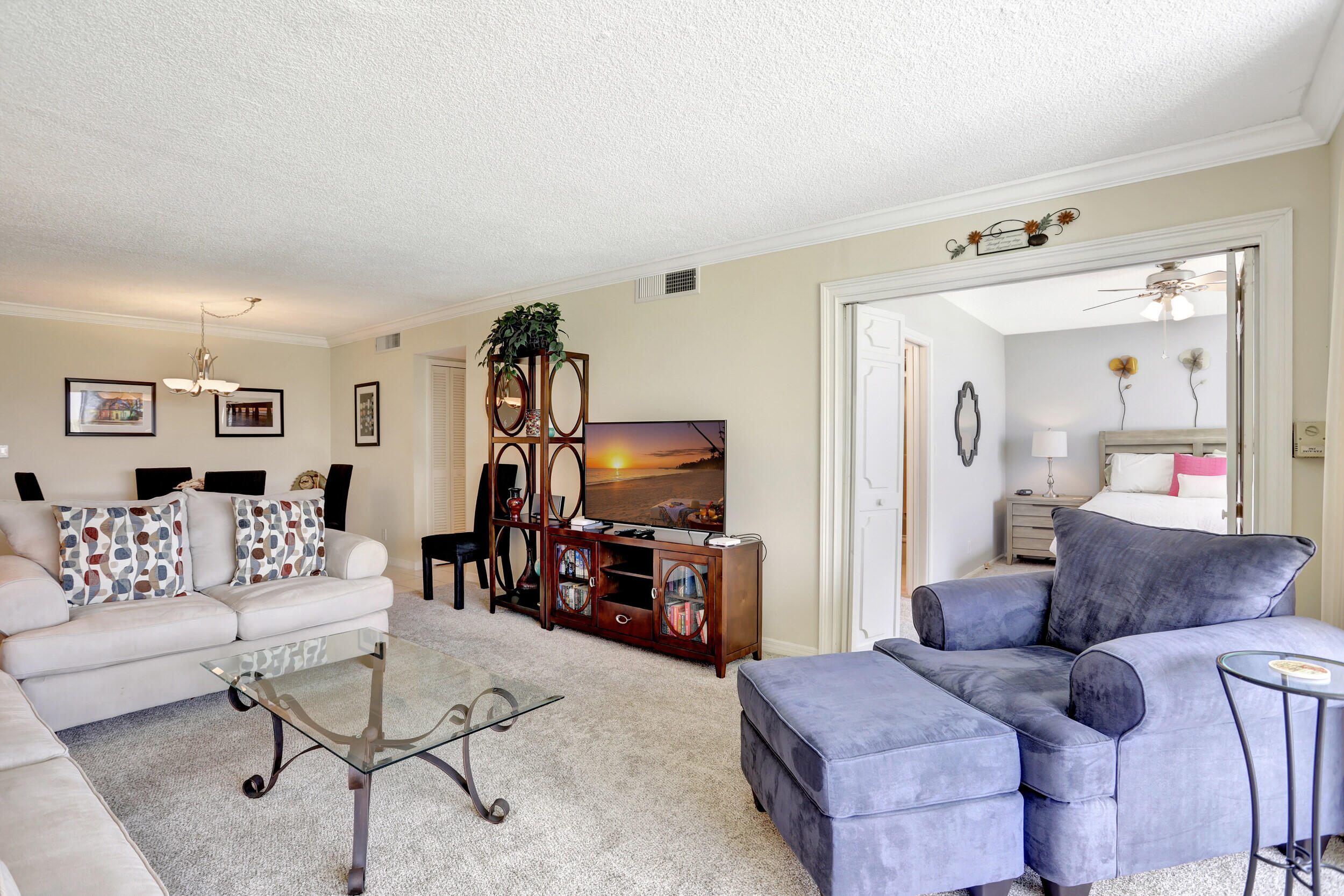 3001 South Course Drive, Unit 508 Pompano Beach, FL 33069 - Photo 13 of 36 a living room with furniture and a flat screen tv