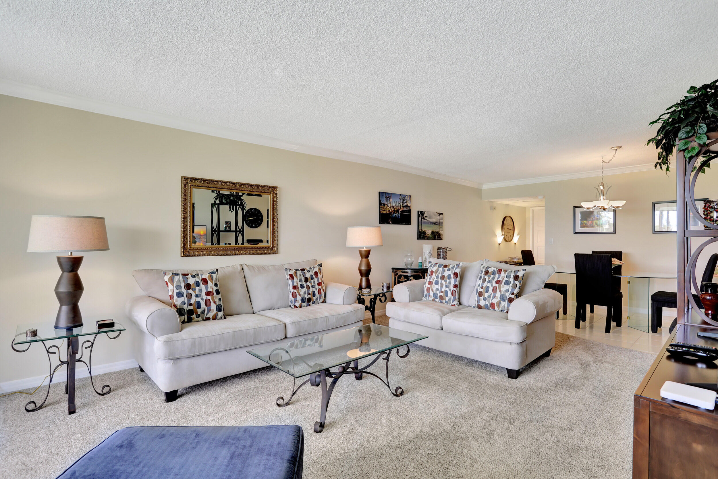3001 South Course Drive, Unit 508 Pompano Beach, FL 33069 - Photo 14 of 36 a living room with furniture and a lamp