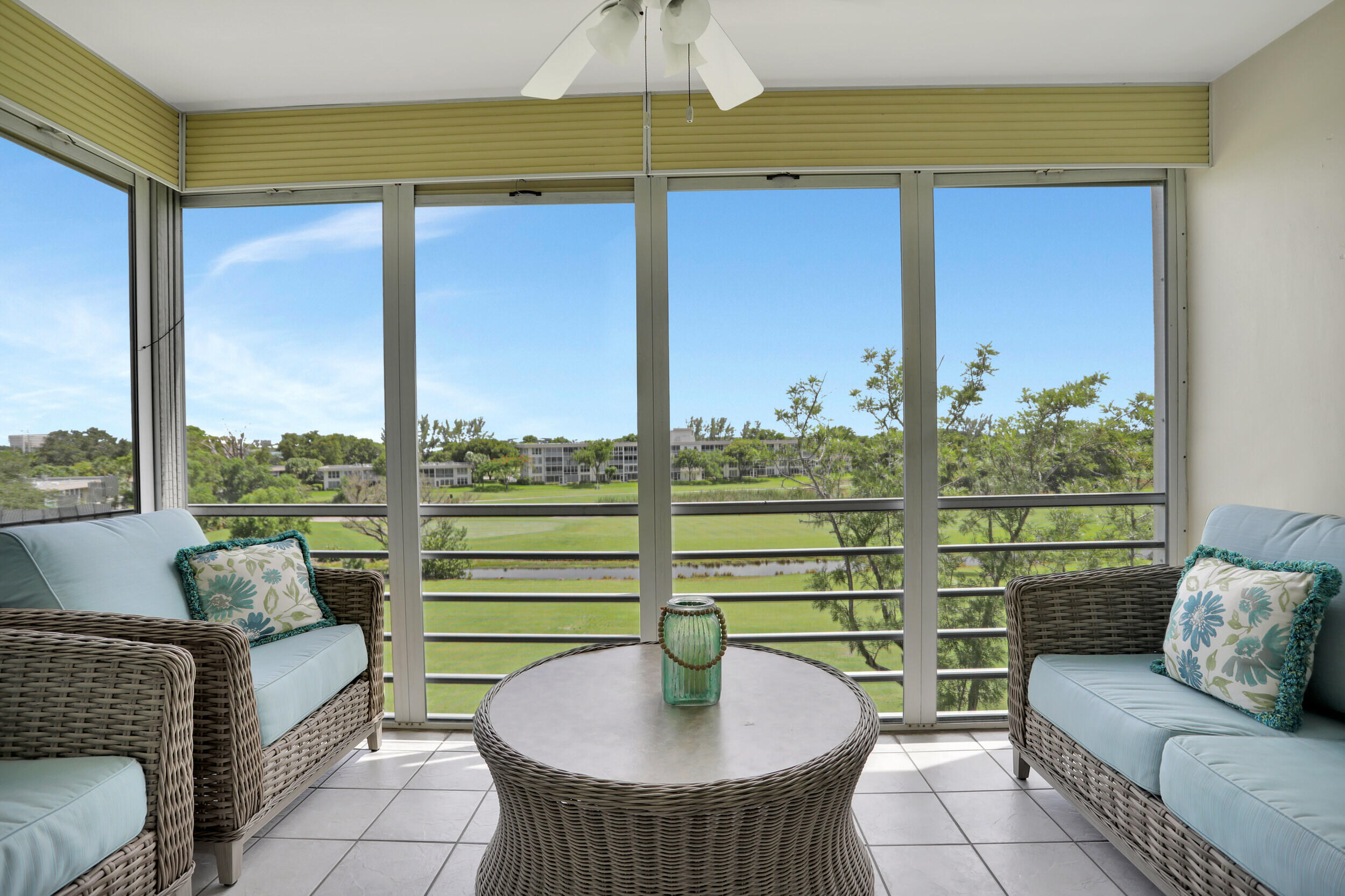 3001 South Course Drive, Unit 508 Pompano Beach, FL 33069 - Photo 25 of 36 a living room with furniture and a table