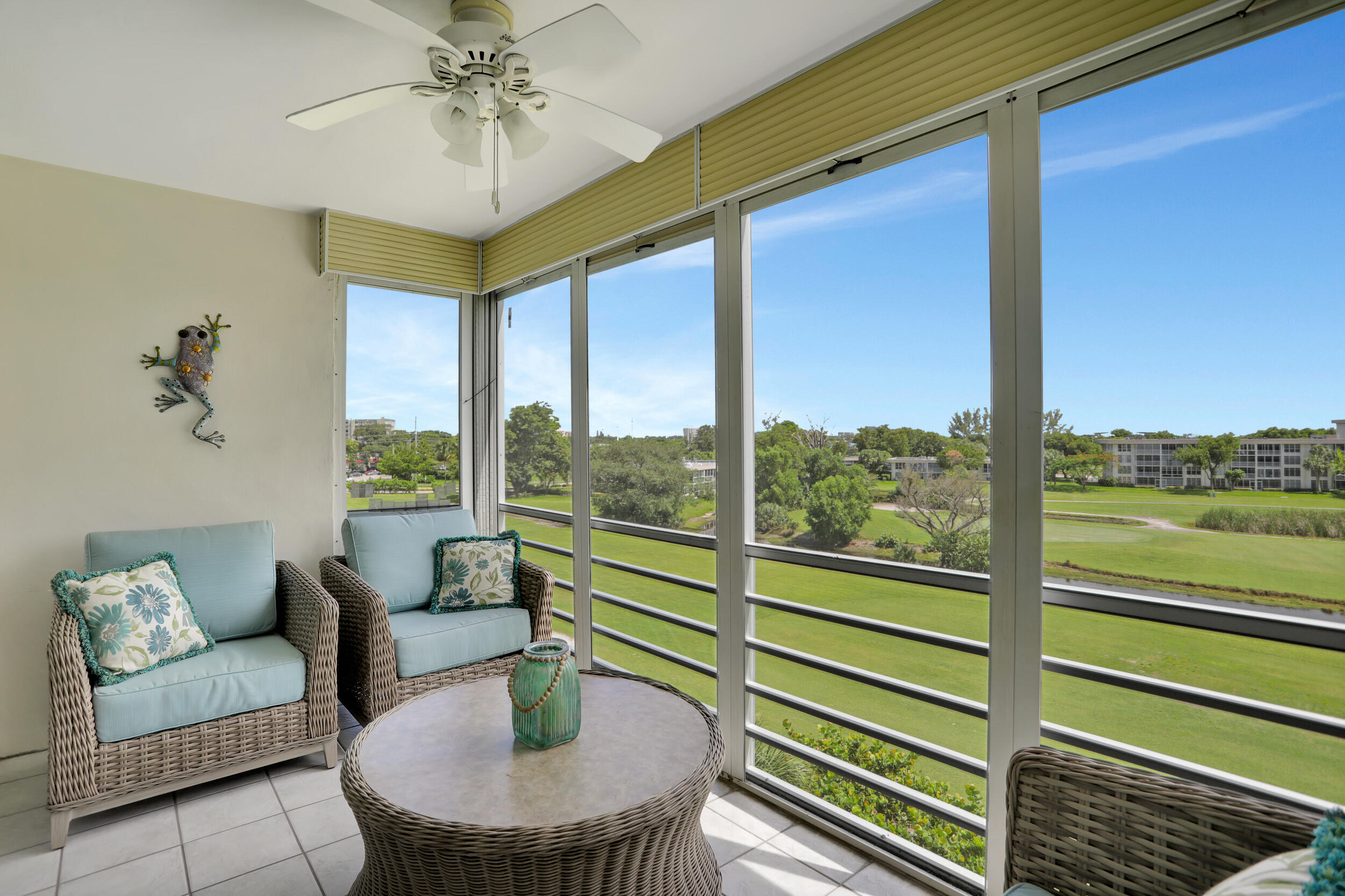 3001 South Course Drive, Unit 508 Pompano Beach, FL 33069 - Photo 26 of 36 a living room with furniture and a large window