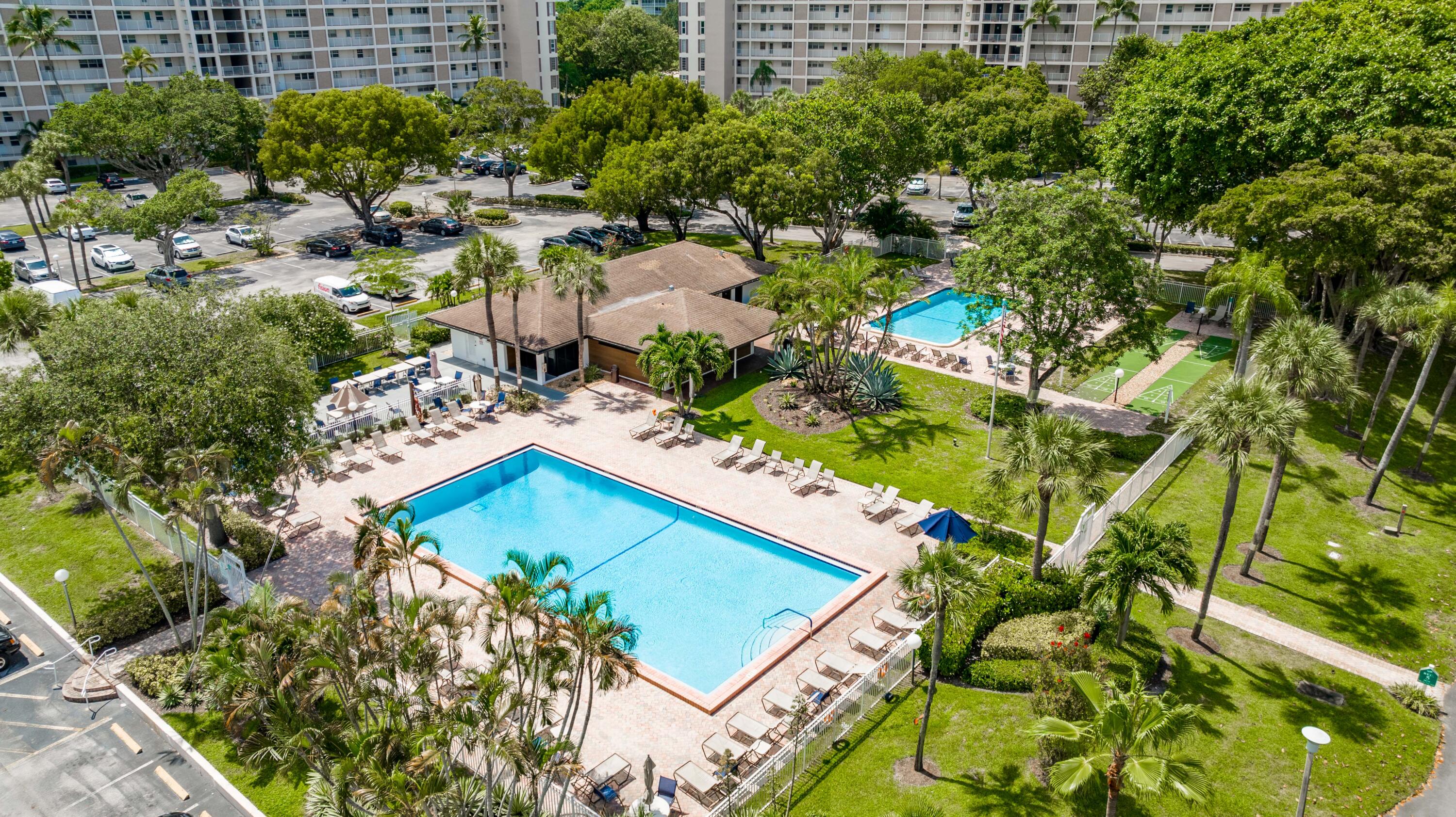 3001 South Course Drive, Unit 508 Pompano Beach, FL 33069 - Photo 31 of 36 a view of residential house with outdoor space and trees