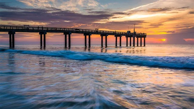 a view of a swimming pool with an outdoor seating