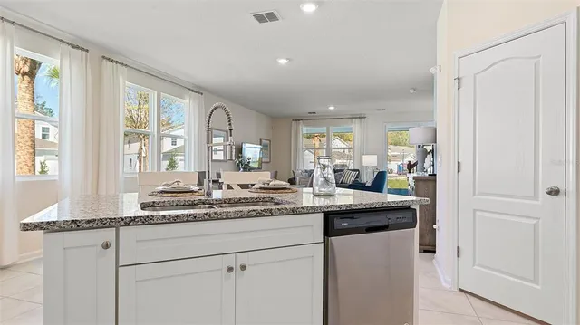 a kitchen with stainless steel appliances granite countertop cabinets and a granite counter tops
