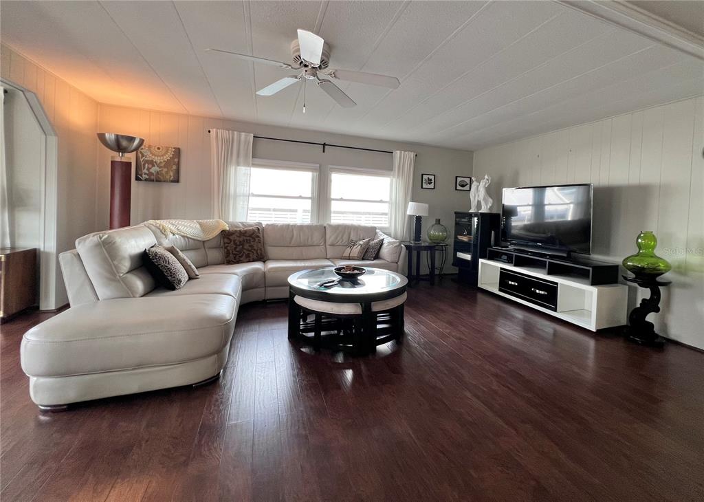 1100 South Belcher Road, Unit 772 Largo, FL 33771 - Photo 16 of 84 a living room with furniture and a wooden floor