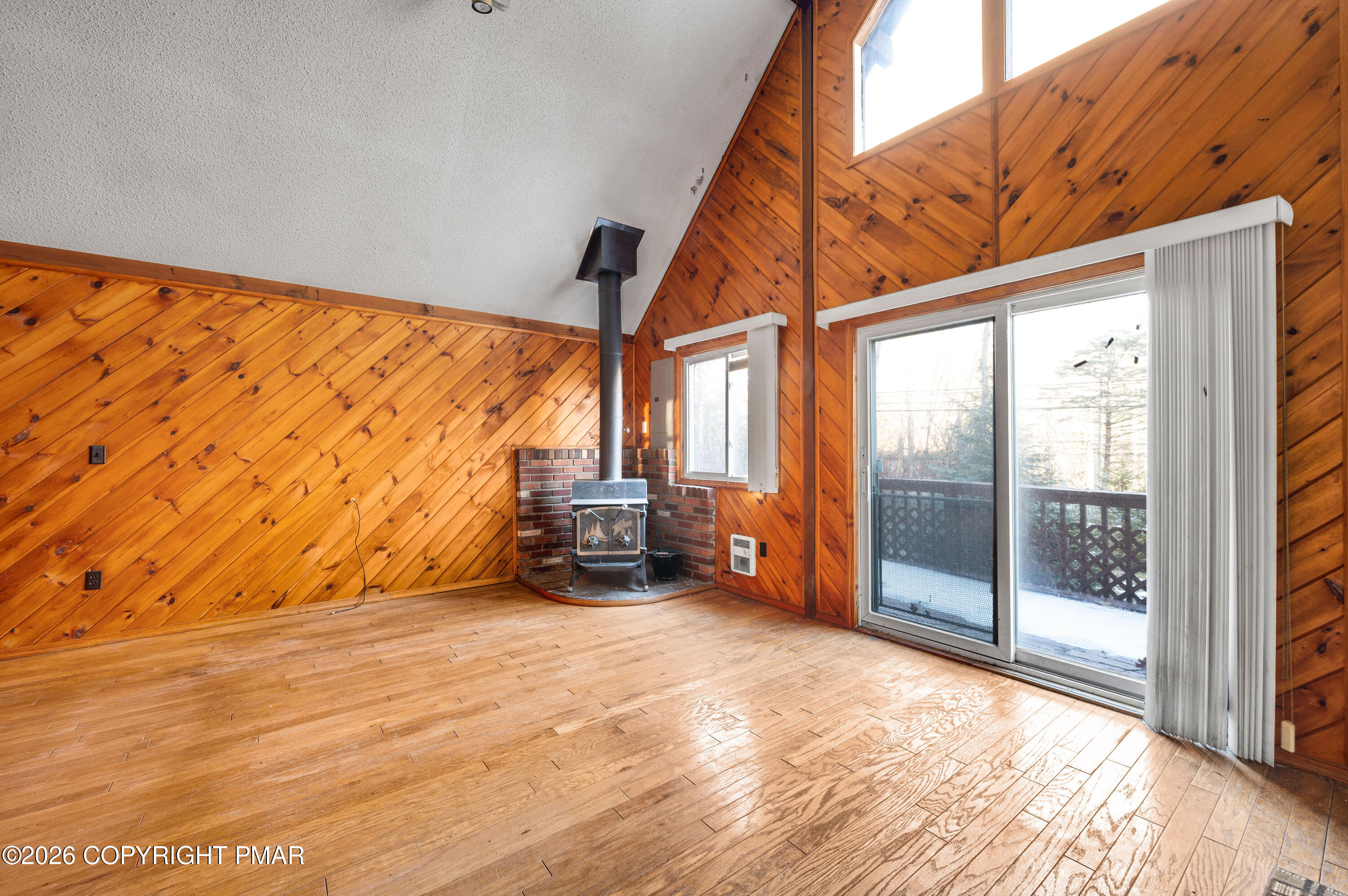 5791 Decker Road Bushkill, PA 18324 - Photo 8 of 17 a view of a room with wooden floor and furniture