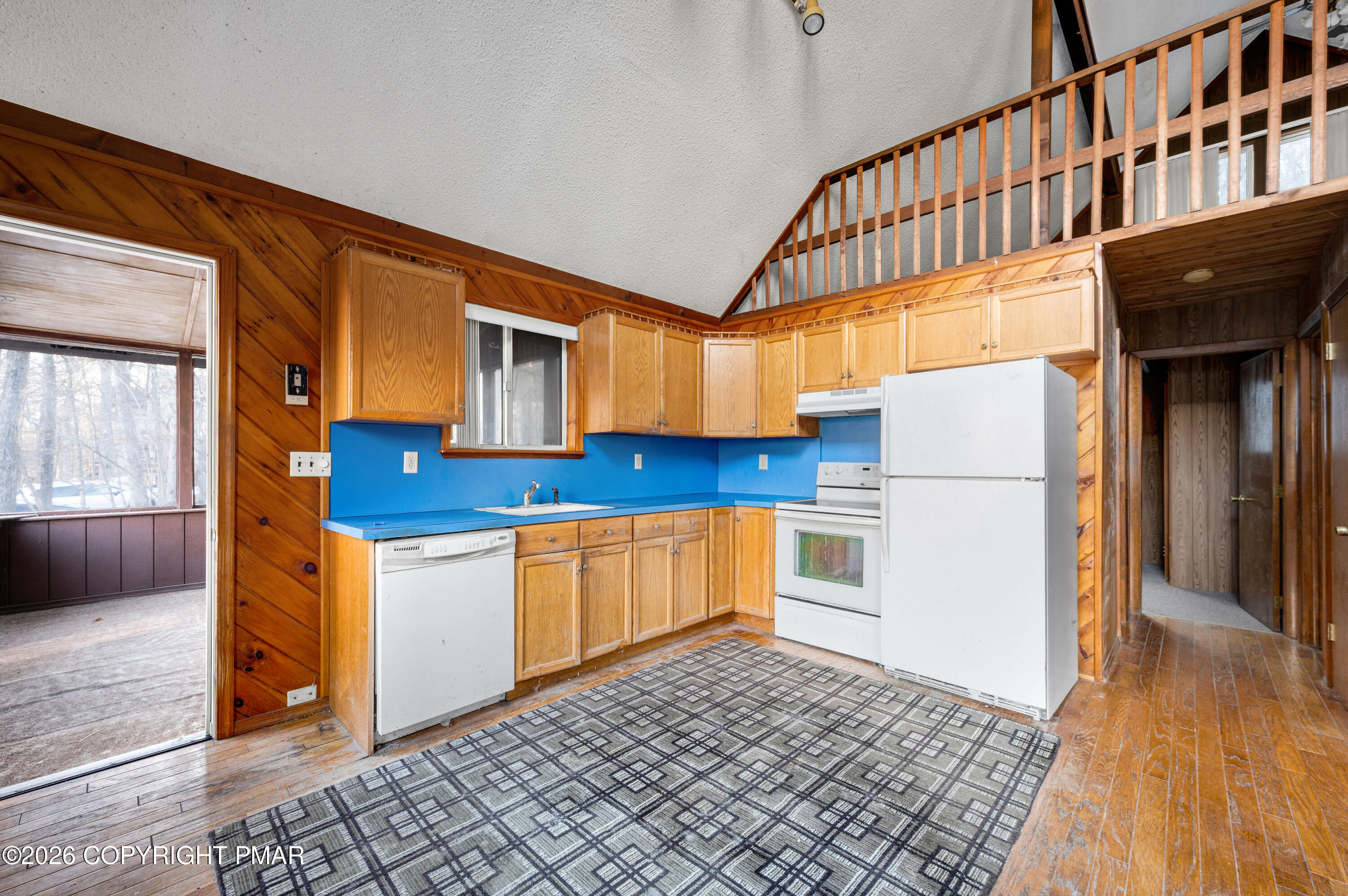5791 Decker Road Bushkill, PA 18324 - Photo 9 of 17 a kitchen with stainless steel appliances granite countertop a refrigerator a stove and a wooden floors