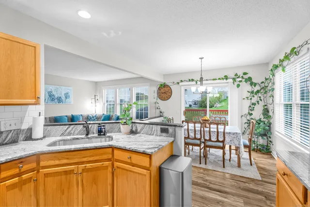 a kitchen with stainless steel appliances granite countertop a sink and cabinets