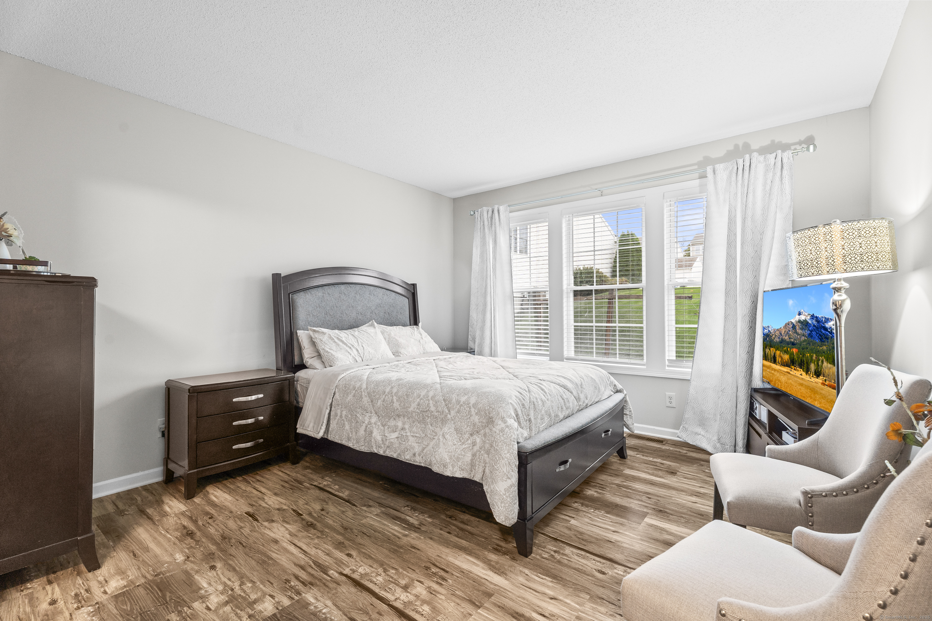 29 Primrose Lane, Unit 29 Suffield, CT 06078 - Photo 13 of 32 a bedroom with a bed and a window