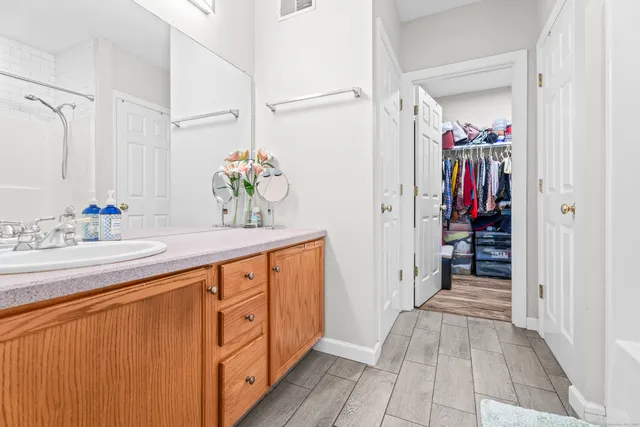 a bathroom with a sink double vanity and a mirror