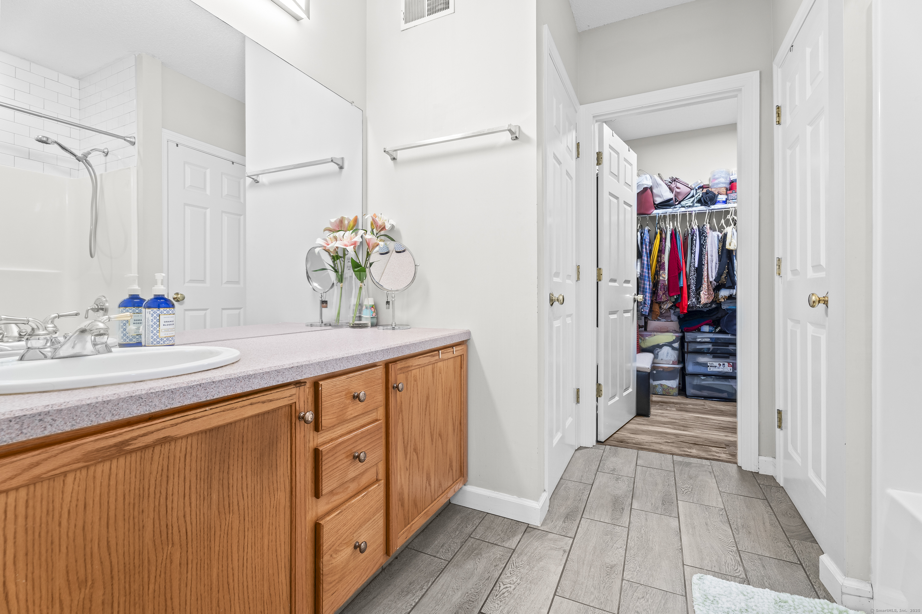 29 Primrose Lane, Unit 29 Suffield, CT 06078 - Photo 15 of 32 a bathroom with a sink double vanity and a mirror