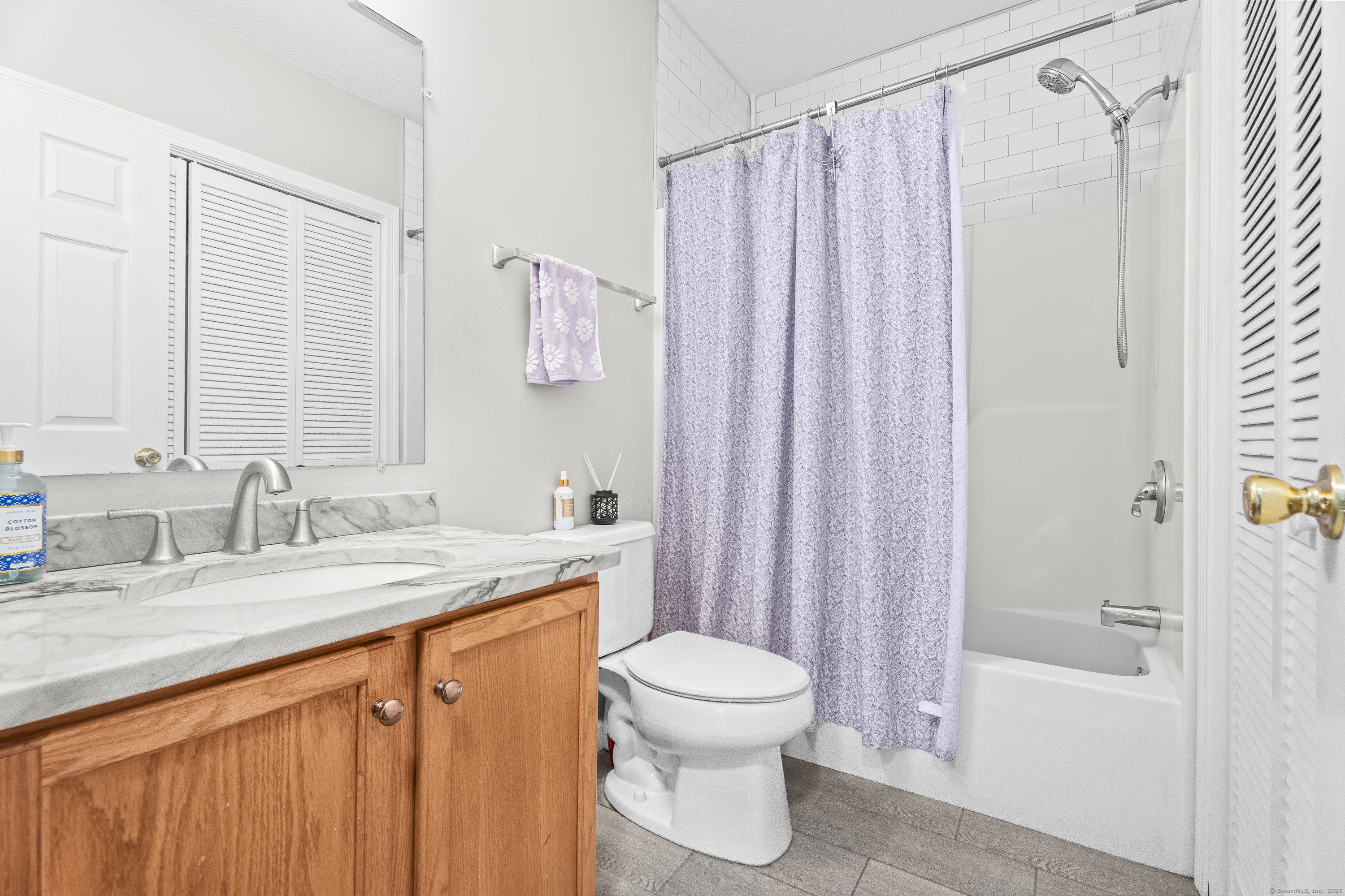 29 Primrose Lane, Unit 29 Suffield, CT 06078 - Photo 20 of 32 a bathroom with a granite countertop sink toilet and shower
