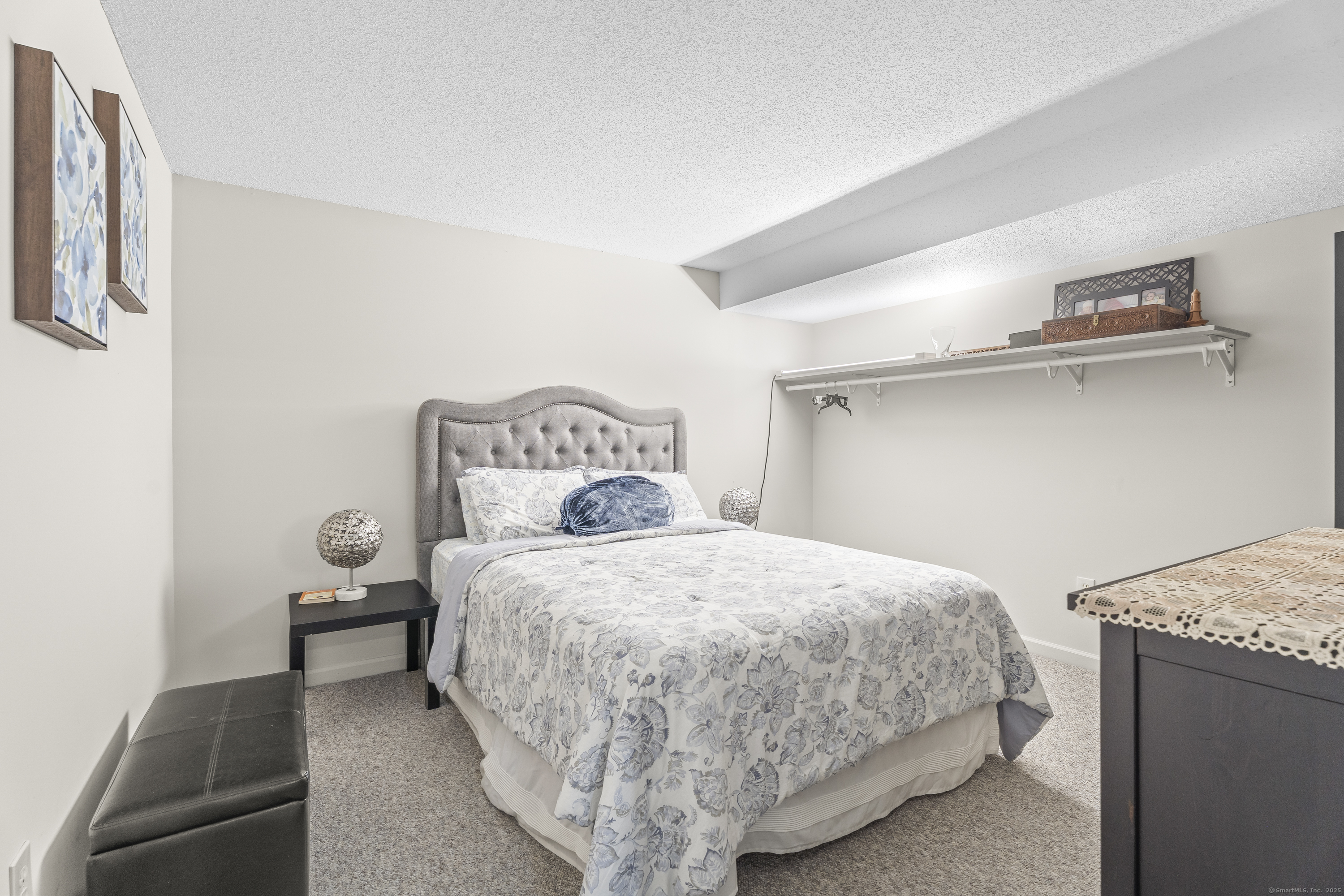 29 Primrose Lane, Unit 29 Suffield, CT 06078 - Photo 22 of 32 a bedroom with a bed and a table