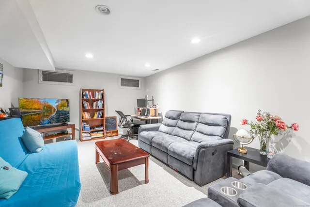 a living room with furniture and a couch