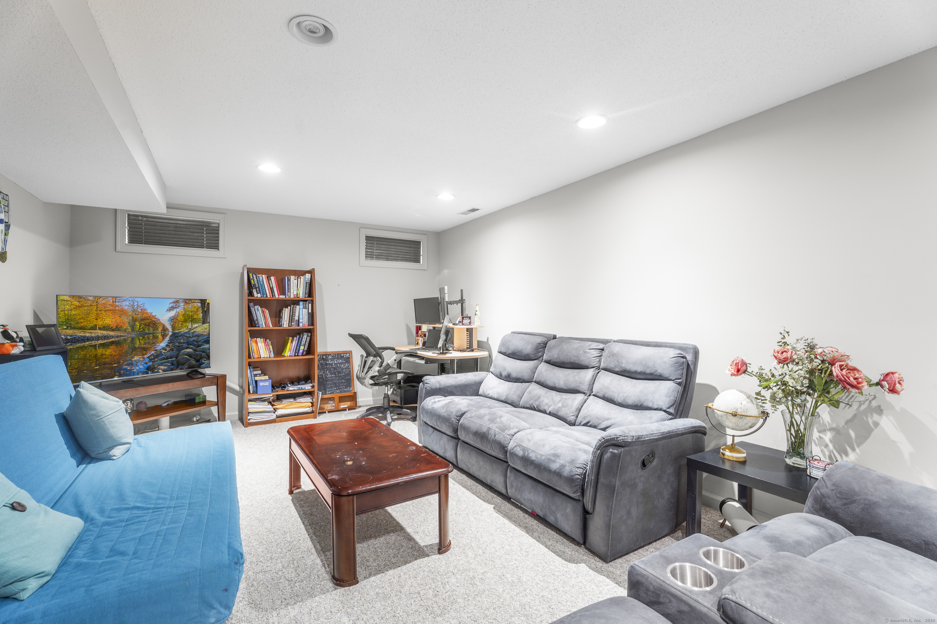 29 Primrose Lane, Unit 29 Suffield, CT 06078 - Photo 24 of 32 a living room with furniture and a couch