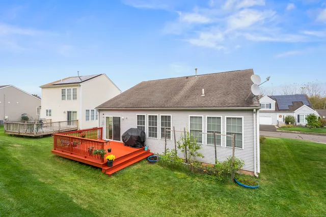 a front view of house with yard and outdoor seating