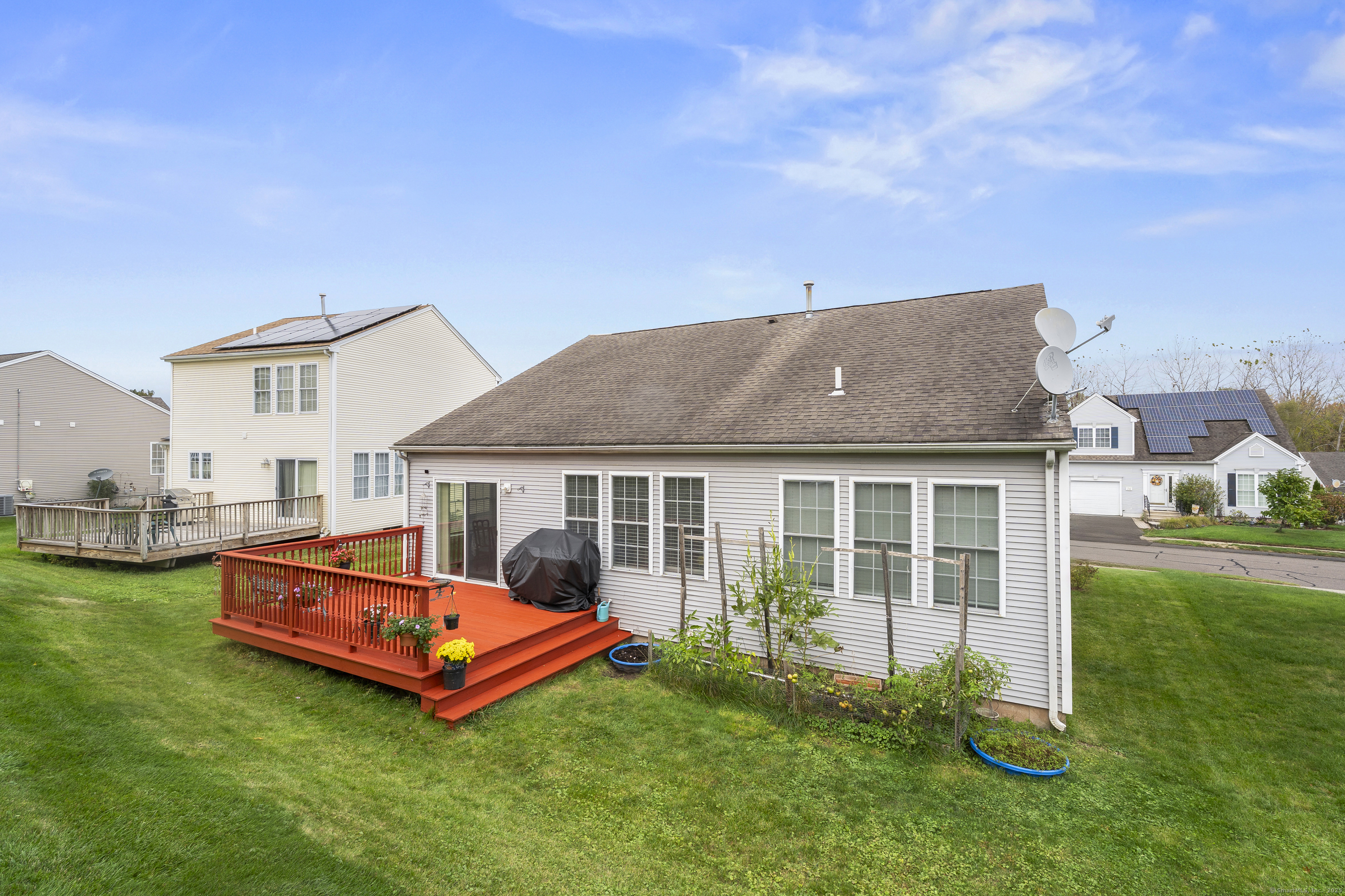 29 Primrose Lane, Unit 29 Suffield, CT 06078 - Photo 30 of 32 a front view of house with yard and outdoor seating
