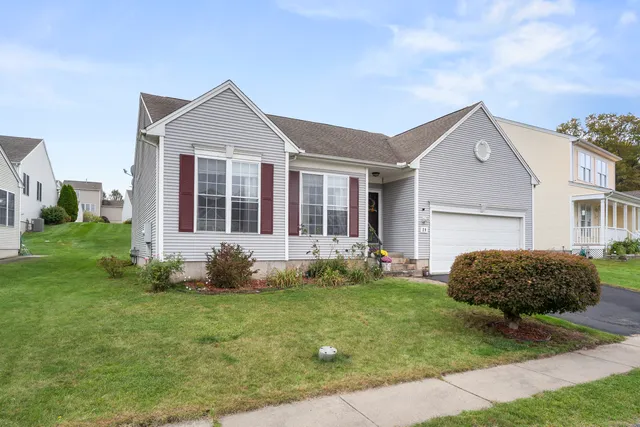 a front view of a house with a yard