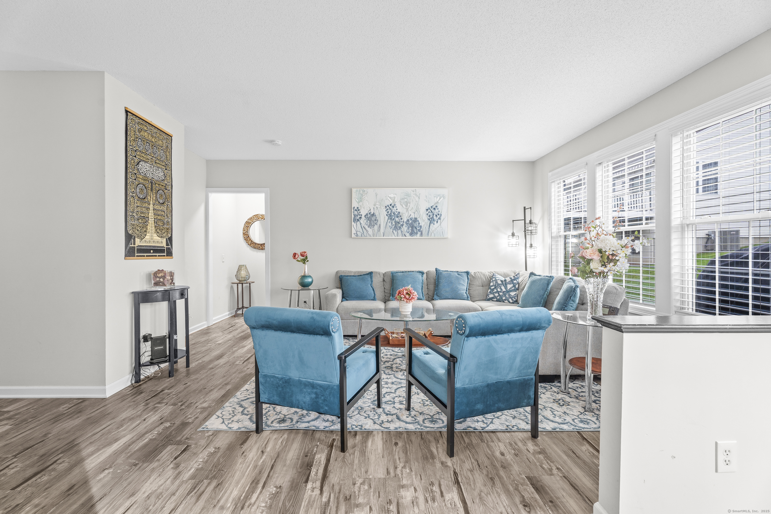 29 Primrose Lane, Unit 29 Suffield, CT 06078 - Photo 6 of 32 a living room with furniture and a table