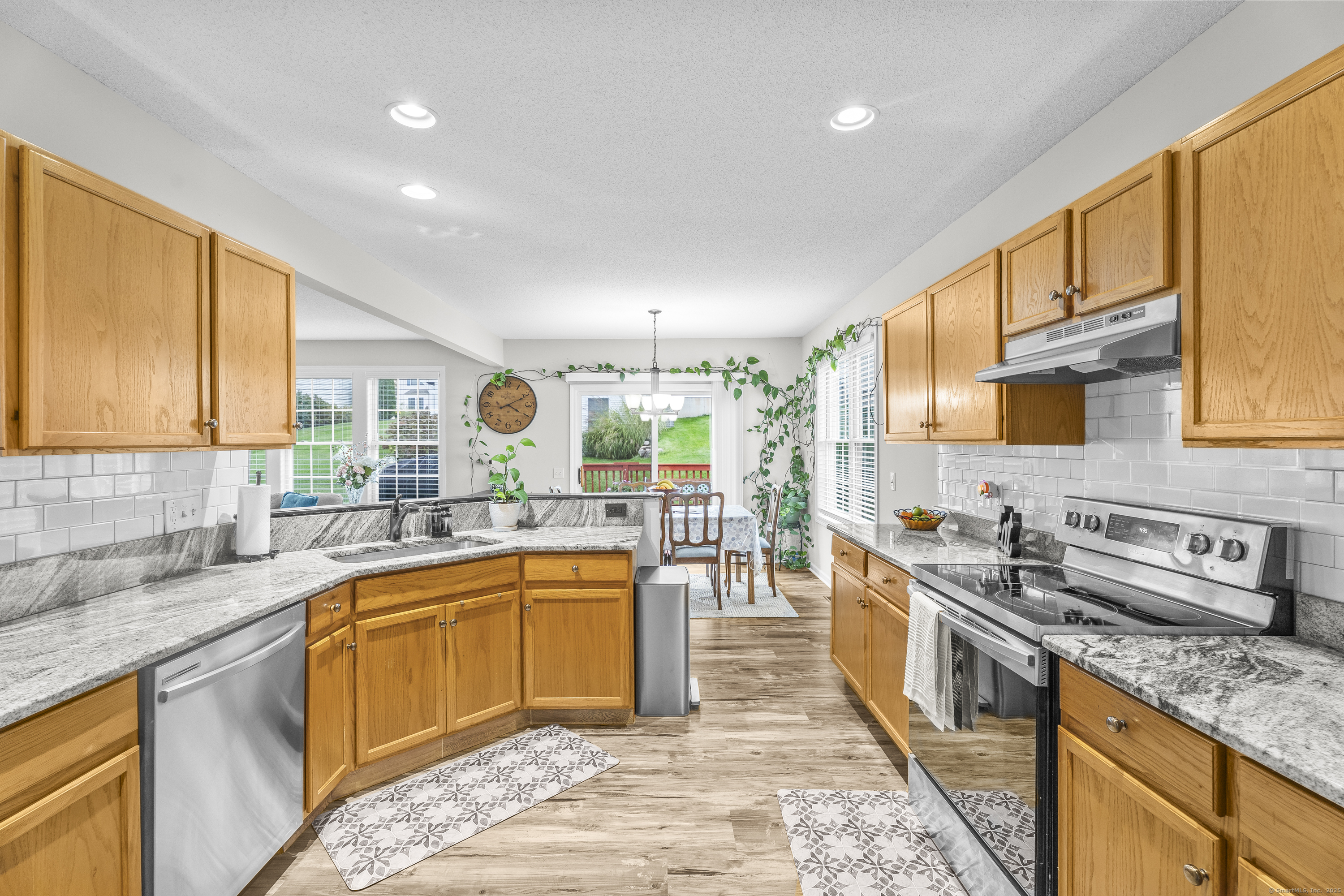 29 Primrose Lane, Unit 29 Suffield, CT 06078 - Photo 10 of 32 a kitchen with stainless steel appliances granite countertop sink stove and cabinets