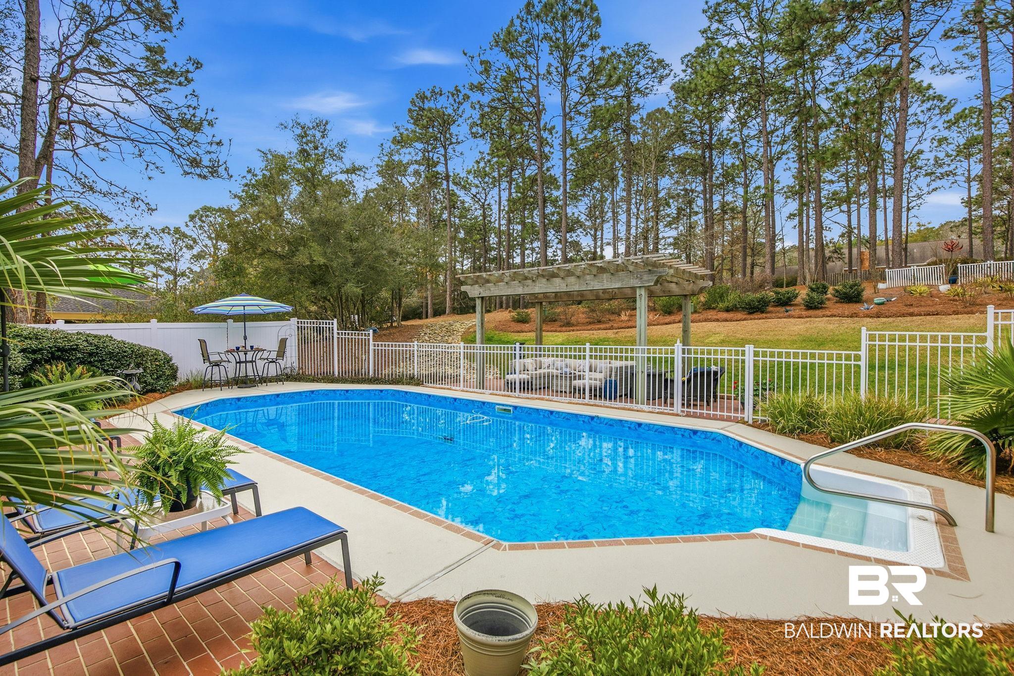 31515 Rhett Drive Spanish Fort, AL 36527 - Photo 73 of 100 32000 gallon pool. All pool furniture and equipment will convey with the home. (Liner replaced in 2023; sand filter in 2025). Pool deck was recently leveled with a 5 year warranty.