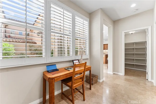 a blue chair sitting in front of a window