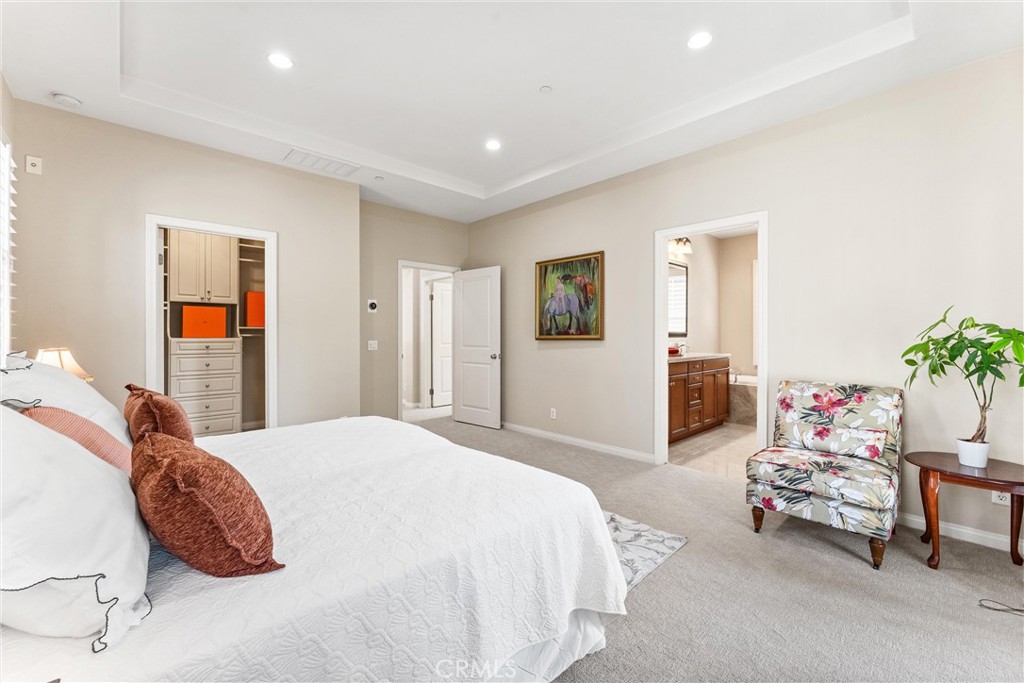 37 Peony Irvine, CA 92618 - Photo 27 of 56 a spacious bedroom with a bed and a couch