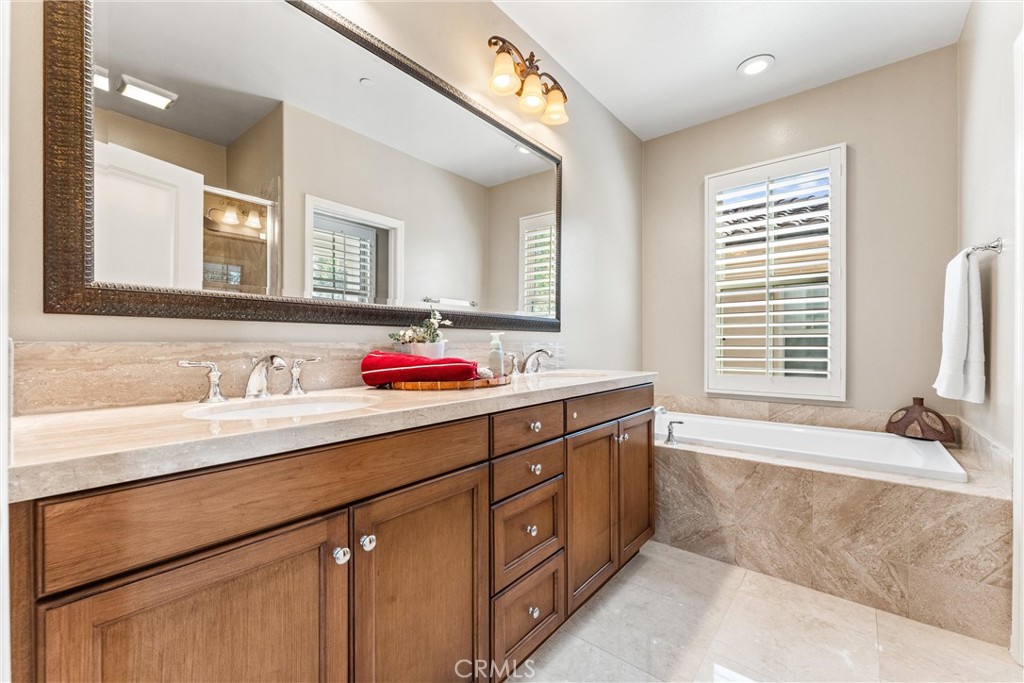 37 Peony Irvine, CA 92618 - Photo 29 of 56 a bathroom with a sink double vanity and a bathtub