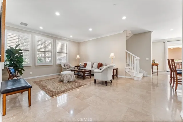 a living room with furniture window and wooden floor