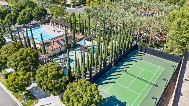 a house view with a sitting space fire pit and outdoor space