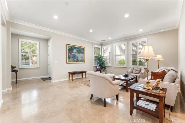 a living room with furniture a table and a window