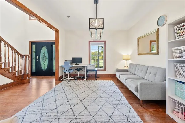 a living room with furniture window and wooden floor