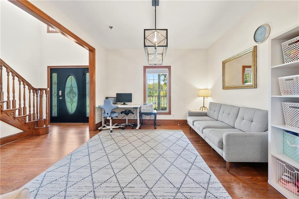 422 Blessings Lane Nicholson, GA 30565 - Photo 16 of 90 a living room with furniture a window and a chandelier