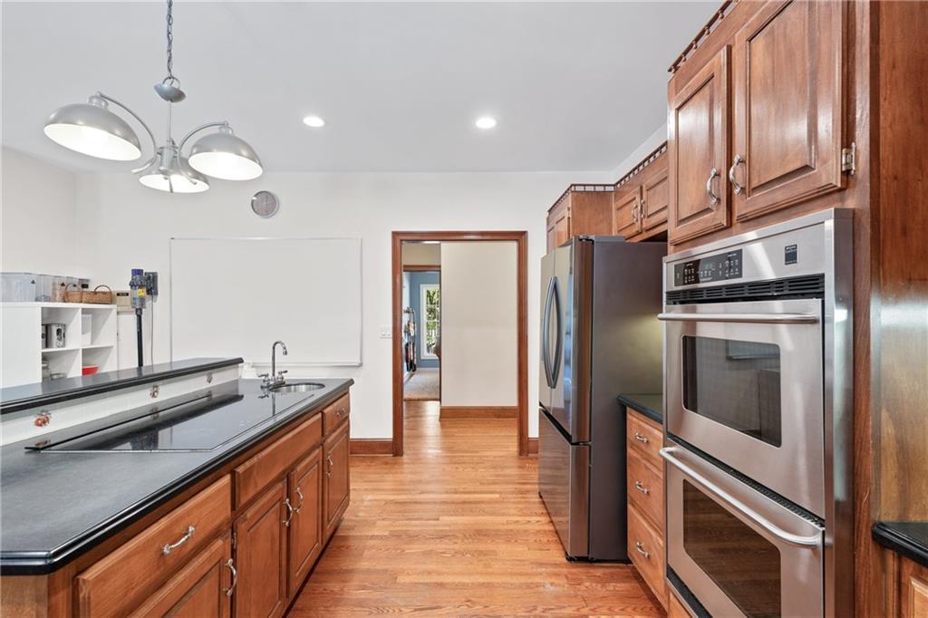 422 Blessings Lane Nicholson, GA 30565 - Photo 22 of 90 a kitchen with stainless steel appliances granite countertop a sink a stove and a refrigerator