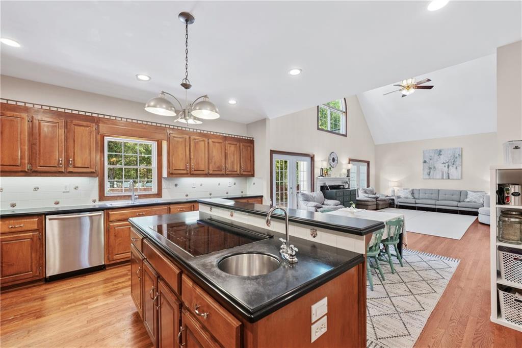 422 Blessings Lane Nicholson, GA 30565 - Photo 24 of 90 a kitchen with granite countertop a sink stove and cabinets