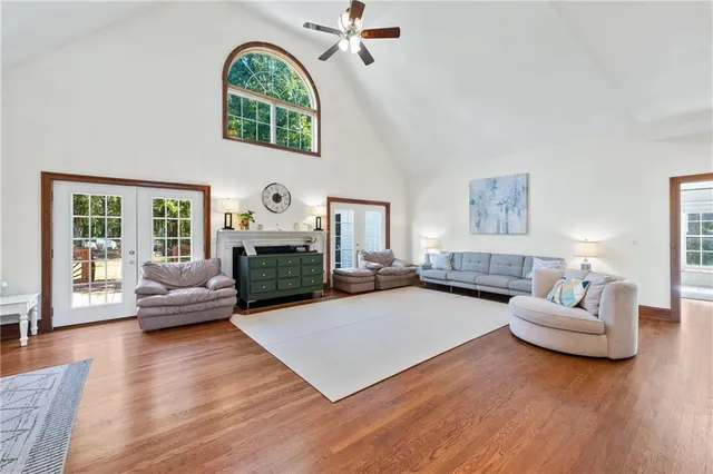 a living room with a bed furniture and a window