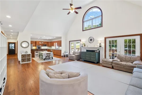a living room with furniture and a book shelf