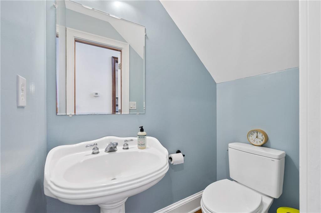 422 Blessings Lane Nicholson, GA 30565 - Photo 28 of 90 a bathroom with a sink a toilet and mirror