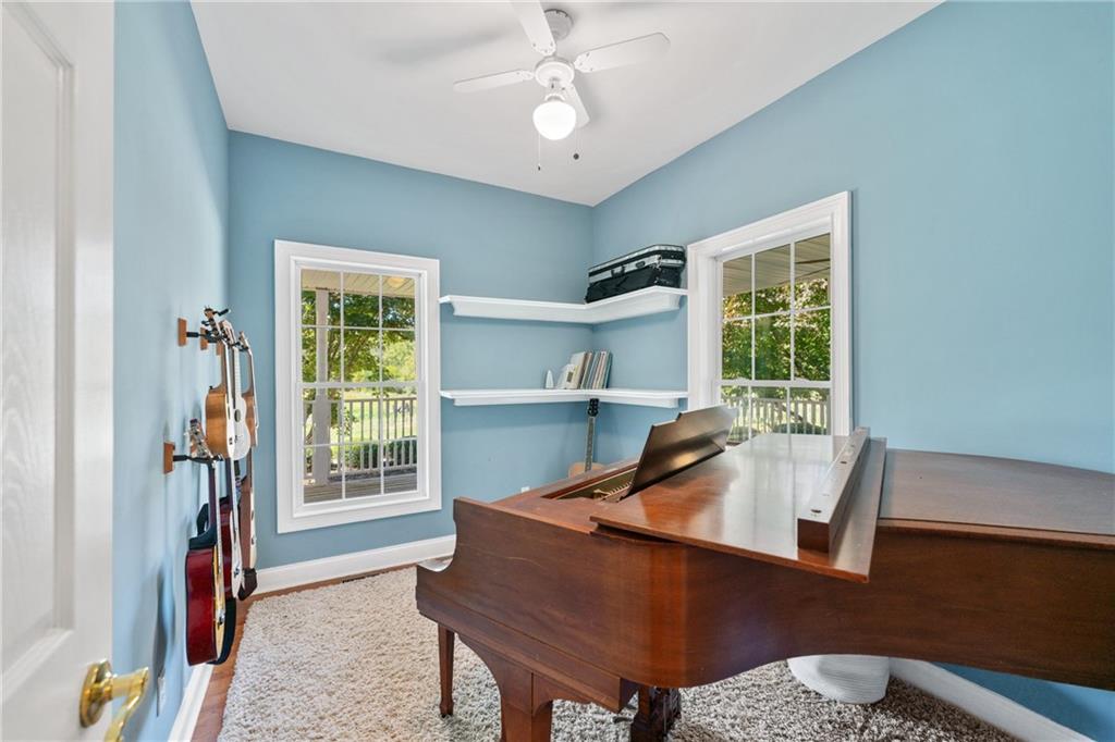 422 Blessings Lane Nicholson, GA 30565 - Photo 29 of 90 a living room with furniture and a window