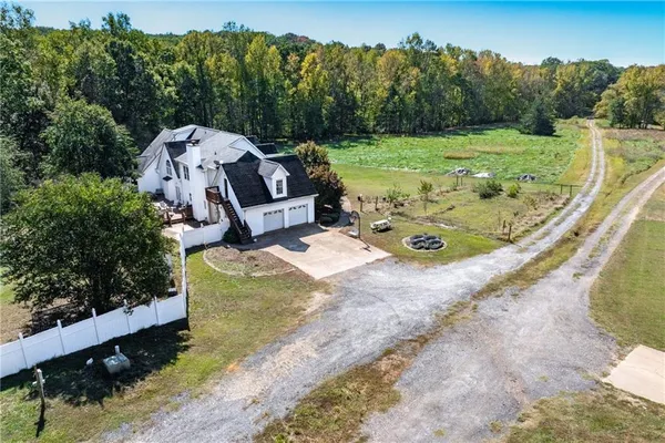a view of a wooden house with a yard
