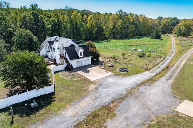 a view of a wooden house with a yard