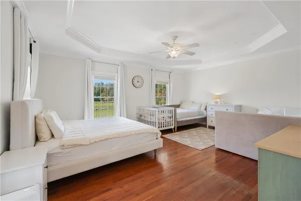 a bathroom with a granite countertop sink and a large mirror