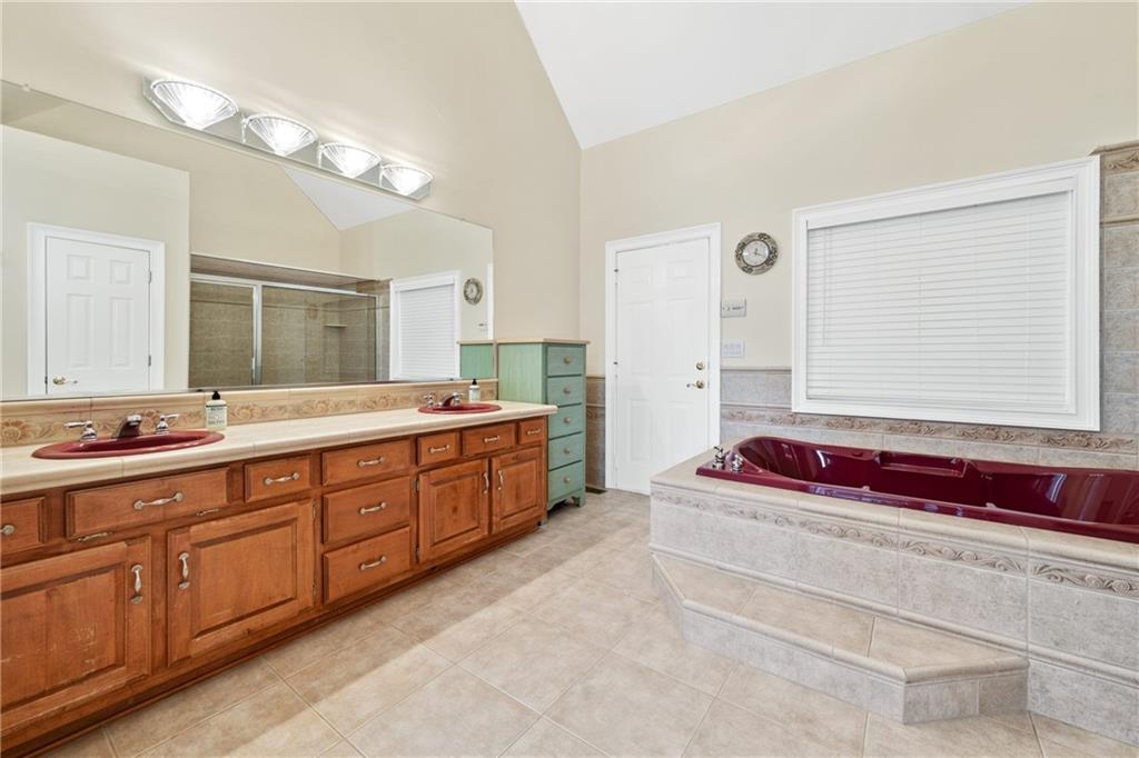 422 Blessings Lane Nicholson, GA 30565 - Photo 37 of 90 a spacious bathroom with stainless steel appliances double vanity and a sink
