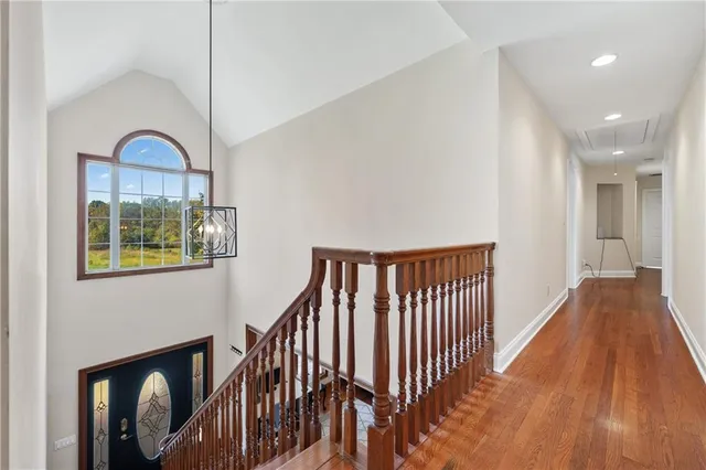 a backyard of a house with a yard and outdoor seating