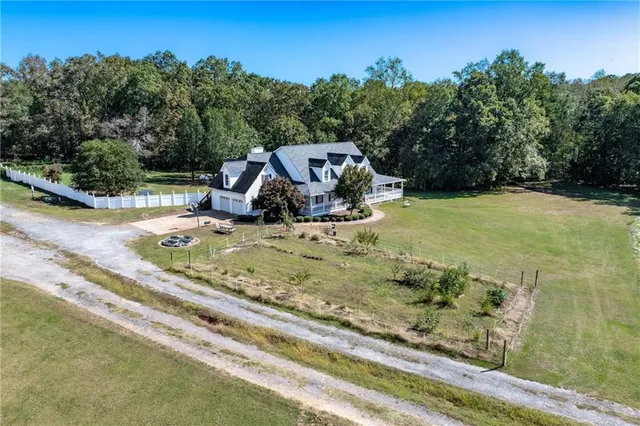 a living room with furniture a window and a chandelier