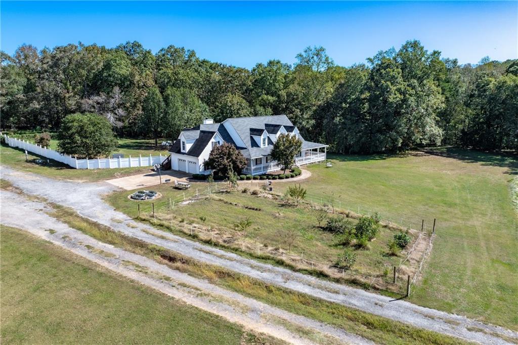 422 Blessings Lane Nicholson, GA 30565 - Photo 4 of 90 a view of a wooden house with a yard