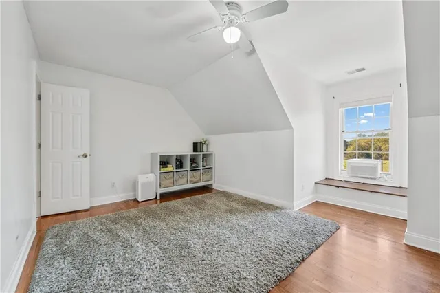 a view of a wooden deck next to a yard